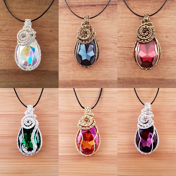 6 Swarovski pear drop pendants in various colours